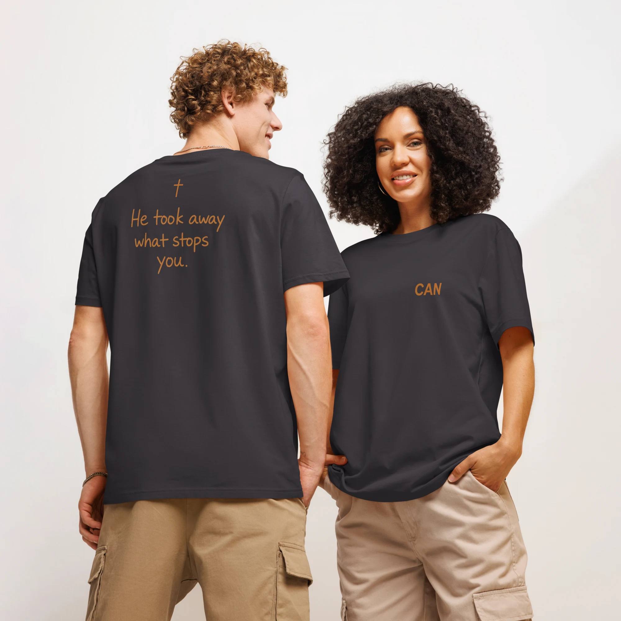 CAN Testimony Tee in anthracite — modeled by a man (back) and a woman (front)